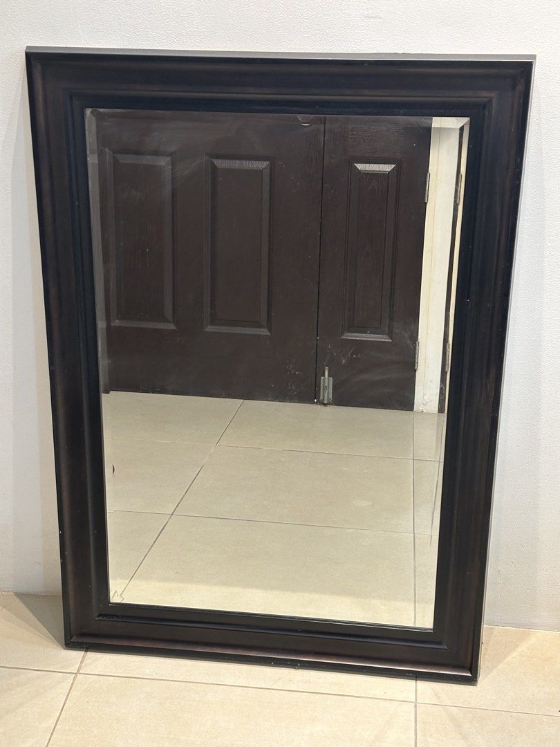 Large dark brown wood framed wall mirror (Category: Mirrors) located in Manila. Submitted by anjcuenca (Listing ID 1468285699, Image 2). Description: - Large rectangular wooden mirror with a thick, sturdy dark brown frame - Classic dark finish effortlessly complements any furniture style - Simple stepped moulding profile with clean, distortion-free glass reflection - Versatile design can be hung both horizontally or vertically - Heavy-duty build,