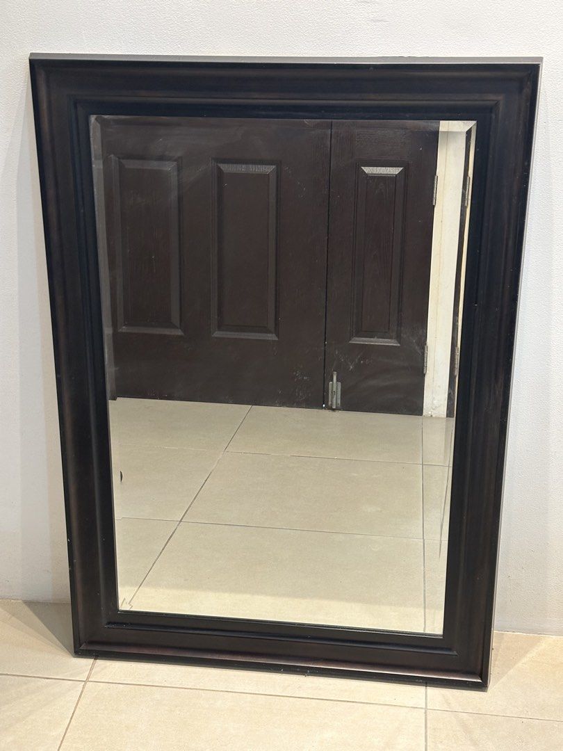 Large dark brown wood framed wall mirror (Category: Mirrors) located in Manila. Submitted by anjcuenca (Listing ID 1468285699, Image 1). Description: - Large rectangular wooden mirror with a thick, sturdy dark brown frame - Classic dark finish effortlessly complements any furniture style - Simple stepped moulding profile with clean, distortion-free glass reflection - Versatile design can be hung both horizontally or vertically - Heavy-duty build,