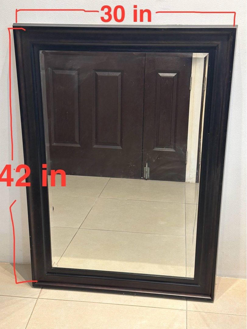 Large dark brown wood framed wall mirror (Category: Mirrors) located in Manila. Submitted by anjcuenca (Listing ID 1468285699, Image 3). Description: - Large rectangular wooden mirror with a thick, sturdy dark brown frame - Classic dark finish effortlessly complements any furniture style - Simple stepped moulding profile with clean, distortion-free glass reflection - Versatile design can be hung both horizontally or vertically - Heavy-duty build,
