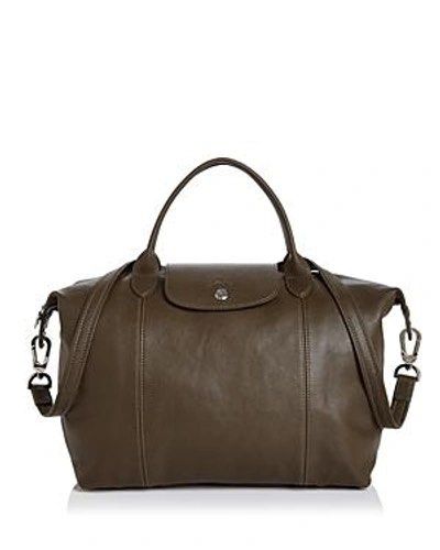 Large Leather Longchamp Cuir (Category: Luxury Bags & Wallets) located in Quezon City. Submitted by PrelovedTreasureees (Listing ID 1468336493, Image 1). Description: - Genuine leather - Has a few marks on it from usage (pls refer to pics) - Comes with a dust bag and detachable strap - Foldable.