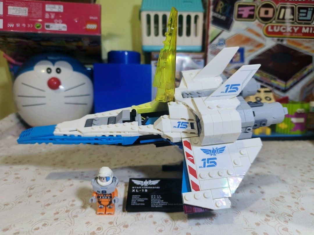 LEGO Buzz Lightyear XL-15 Spaceship (Category: Lego & Building Sets) located in Caloocan City. Submitted by mckysprelove (Listing ID 1468425148, Image 1). Description: - LEGO Star Command XL-15 spaceship set - Features buildable white and blue aircraft with yellow cockpit canopy and adjustable engines - Includes pilot minifigure in orange spacesuit with helmet - Comes with display plaque featuring ship statistics and display stand - Fully assembl