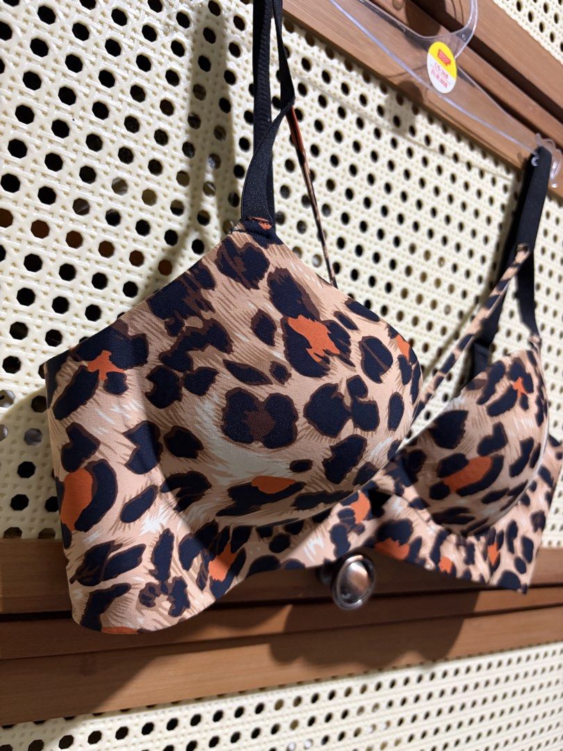 Leopard Print Bra Size 34/75B (Category: Undergarments & Loungewear) located in Pasig City. Submitted by jenfiles (Listing ID 1468439490, Image 2). Description: - Size: 34/75B - Design: Bold leopard print in shades of brown, black, and orange - Straps: Black adjustable straps featuring trendy multi-way front detailing - Support: Underwire cups for a flattering lift and shape - Closure: Classic black fabric back band with hook-and-eye closure.