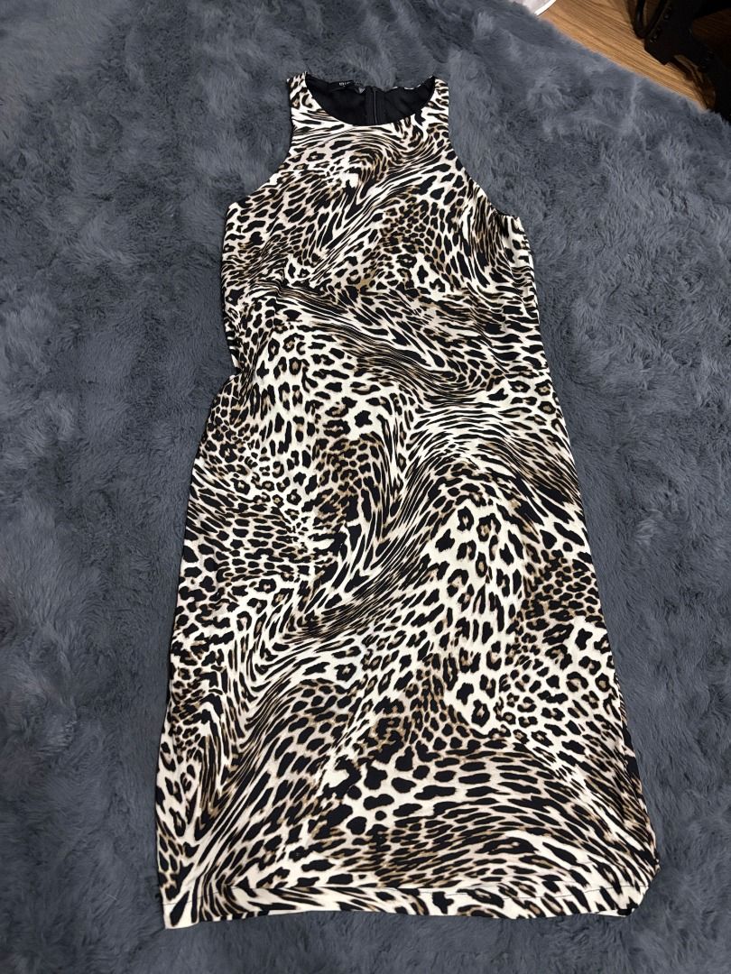 Leopard Print Sleeveless Midi Dress (Category: Dresses) located in Antipolo. Submitted by dddeclutter (Listing ID 1468359577, Image 1). Description: - Style: Sleeveless leopard print dress - Material: Lightweight and comfortable - Occasion: Versatile for casual outings or evening wear.