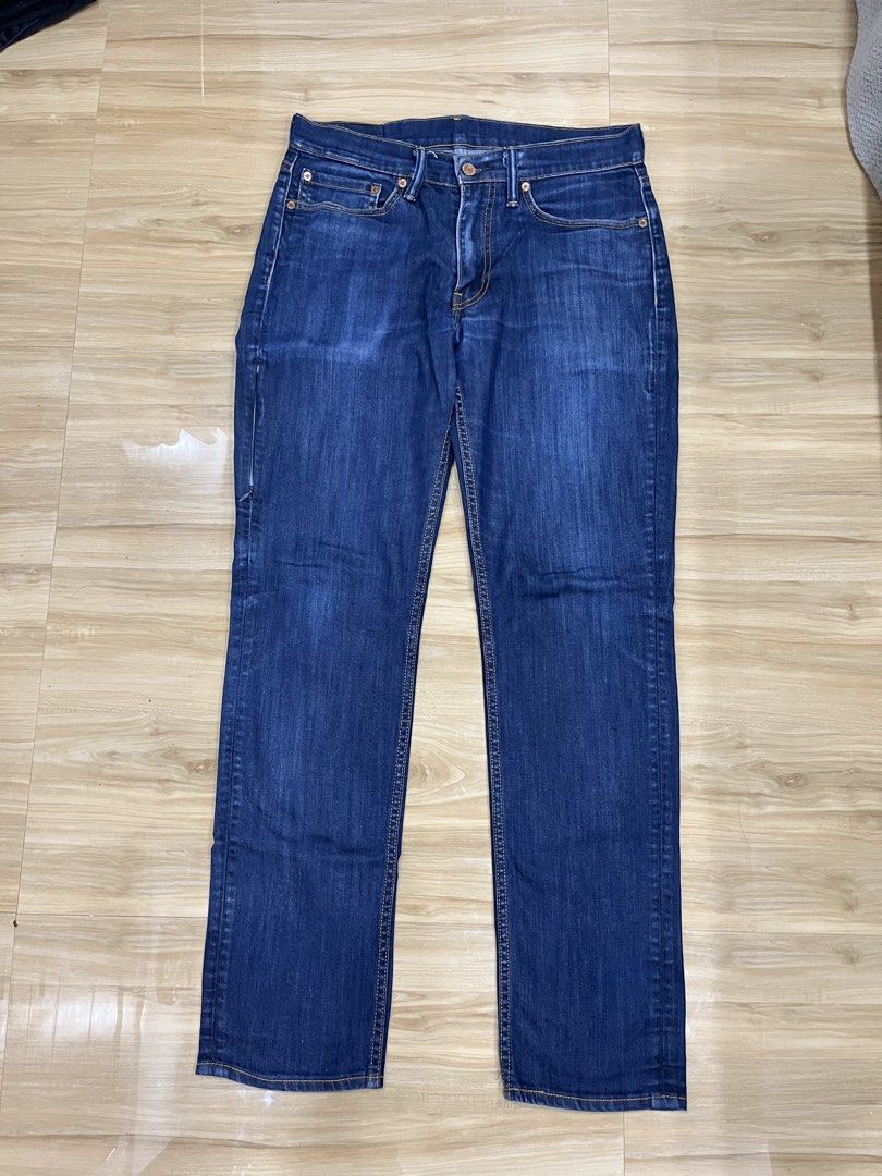 Levi's Dark Wash Denim Jeans (Category: Jeans) located in Angeles City. Submitted by thriftsij (Listing ID 1468447228, Image 1). Description: - Brand: Levi's 511 - Wash: Dark wash denim with slight thigh fading - Fit: Straight leg cut, standard belt loops - Details: Contrast stitching, metal button closures, classic pockets - Lining: Unique interior printed lining - Condition: Excellent, sturdy fabric - Style: Versatile for everyday casual wear.