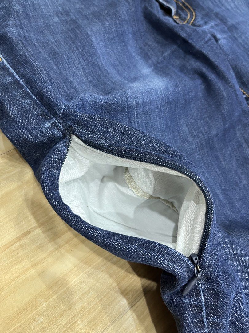 Levi's Dark Wash Denim Jeans (Category: Jeans) located in Angeles City. Submitted by thriftsij (Listing ID 1468447228, Image 3). Description: - Brand: Levi's 511 - Wash: Dark wash denim with slight thigh fading - Fit: Straight leg cut, standard belt loops - Details: Contrast stitching, metal button closures, classic pockets - Lining: Unique interior printed lining - Condition: Excellent, sturdy fabric - Style: Versatile for everyday casual wear.