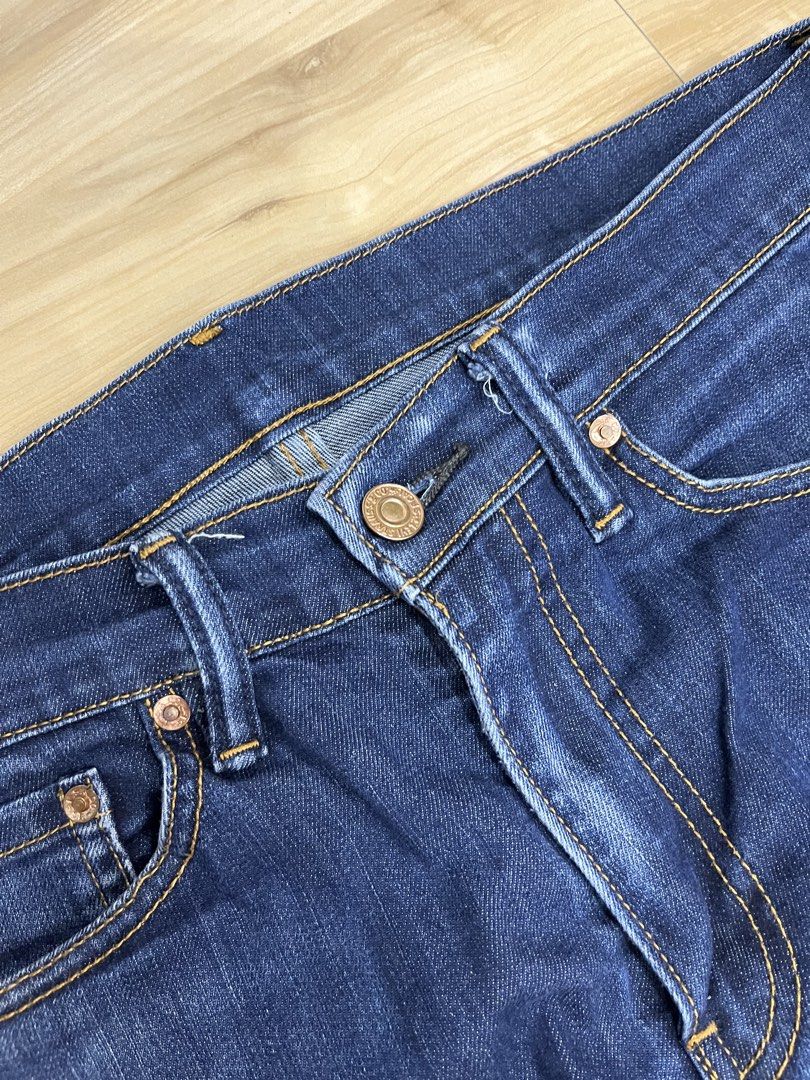 Levi's Dark Wash Denim Jeans (Category: Jeans) located in Angeles City. Submitted by thriftsij (Listing ID 1468447228, Image 2). Description: - Brand: Levi's 511 - Wash: Dark wash denim with slight thigh fading - Fit: Straight leg cut, standard belt loops - Details: Contrast stitching, metal button closures, classic pockets - Lining: Unique interior printed lining - Condition: Excellent, sturdy fabric - Style: Versatile for everyday casual wear.