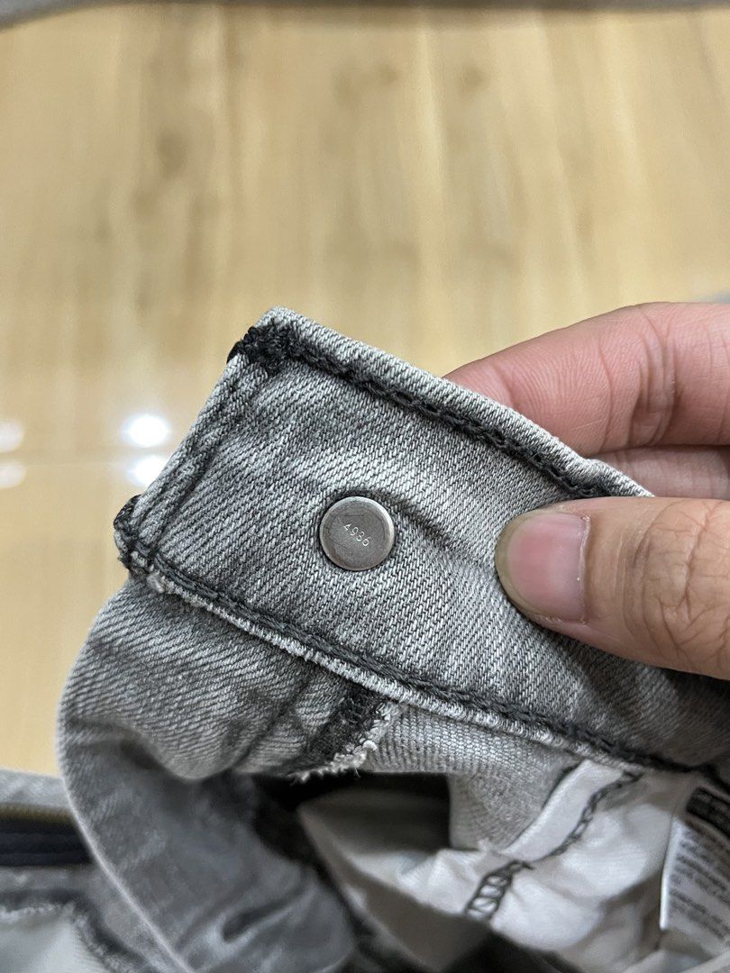 Levi's 514 Grey Distressed Jeans W32 L32 (Category: Jeans) located in Angeles City. Submitted by thriftsij (Listing ID 1468446983, Image 3). Description: - Brand: Levi's 514 - Size: W32 L32 W32 L41 LO7.5 - Color: Classic washed grey - Details: Factory distressed with ripped spots on the front legs and pocket area - Closure: Button fly with stamped button number 4986 - Features: Inside care tags and Levi's printed pocket lining attached - Fit: Com