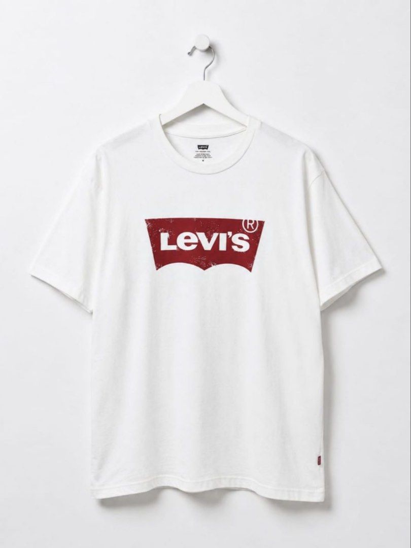 Levi's White Graphic Tee Size S (Category: Tshirts & Polo Shirts ) located in Manila. Submitted by tanlaxfinds (Listing ID 1468321434, Image 2). Description: - Brand: Levi's - Style: White t-shirt with red distressed batwing logo - Size: Small - Material: Soft cotton - Fit: Standard fit with classic crew neck and short sleeves - Origin: Made in Pakistan - Condition: Clean, well-maintained.