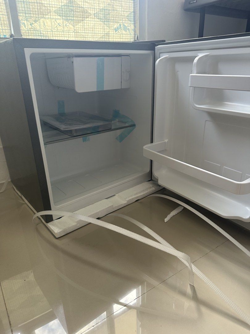 LG Mini Fridge Single Door Refrigerator Dark Grey (Category: Refrigerators and Freezers) located in Mandaluyong City. Submitted by almachristinecruz8160 (Listing ID 1468312091, Image 2). Description: - Brand: LG Compact Mini Fridge - Color: Sleek Dark Grey Finish - Condition: Brand new, never plugged in, still has original protective tape, foam base, and strapping - Features: Single door setup with a small built-in top freezer compartment - Inter