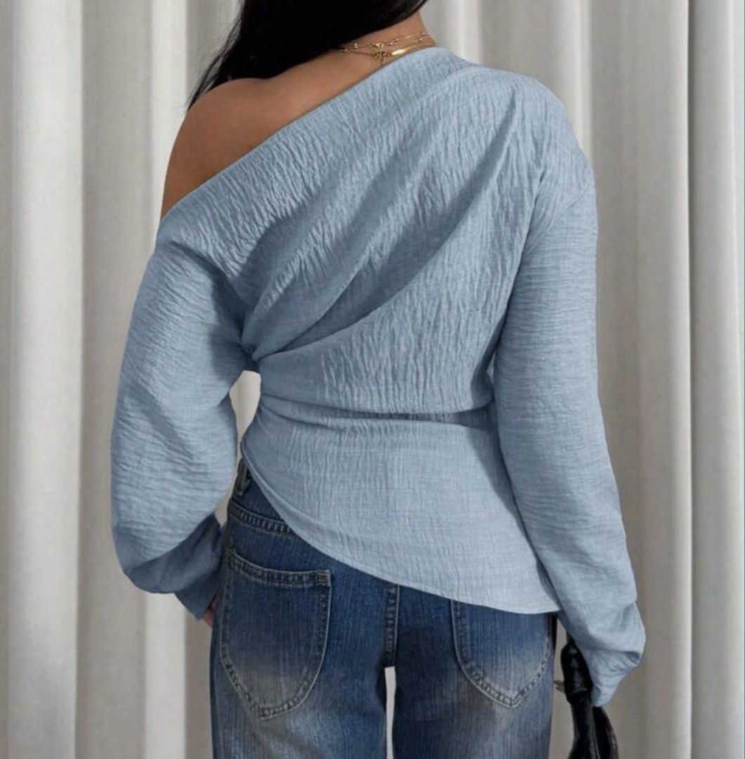 Light Blue One-Shoulder Textured Long Sleeve Blouse (Category: Longsleeves) located in Makati City. Submitted by _fitz (Listing ID 1468428641, Image 2). Description: - Color: Light blue - Design: Asymmetrical one-shoulder neckline - Fabric: Textured material throughout.