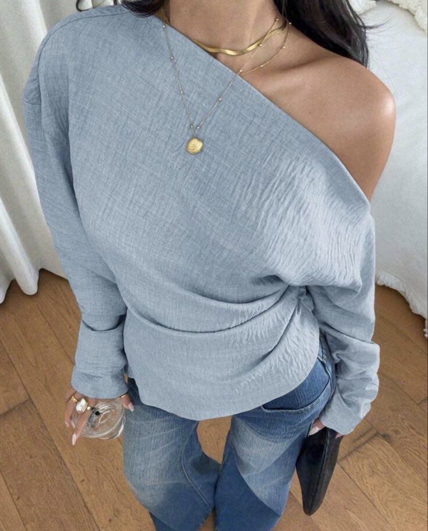 Light Blue One-Shoulder Textured Long Sleeve Blouse (Category: Longsleeves) located in Makati City. Submitted by _fitz (Listing ID 1468428641, Image 1). Description: - Color: Light blue - Design: Asymmetrical one-shoulder neckline - Fabric: Textured material throughout.
