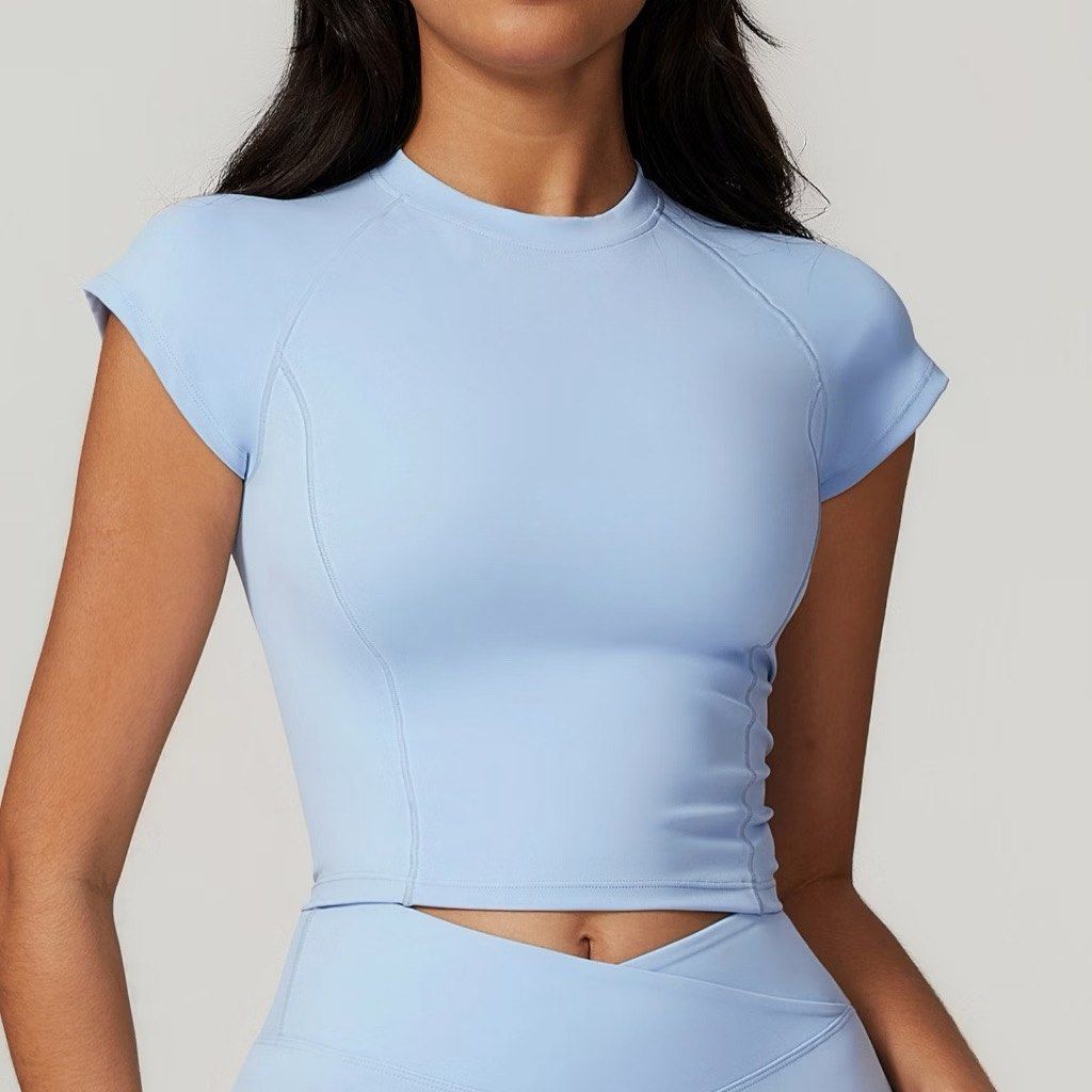 Light Blue Short Sleeve Athletic Crop Top (Category: Activewear) located in Manila. Submitted by potchayy (Listing ID 1468478373, Image 1). Description: - Color: Light blue - Fit: Fitted crop top with short sleeves and crew neckline - Design: Paneled seams on the front and sides for extra shape - Material: Smooth, stretchy, and easy-to-wash fabric - Versatility: Great for workouts or casual days (pairs nicely with matching blue leggings).