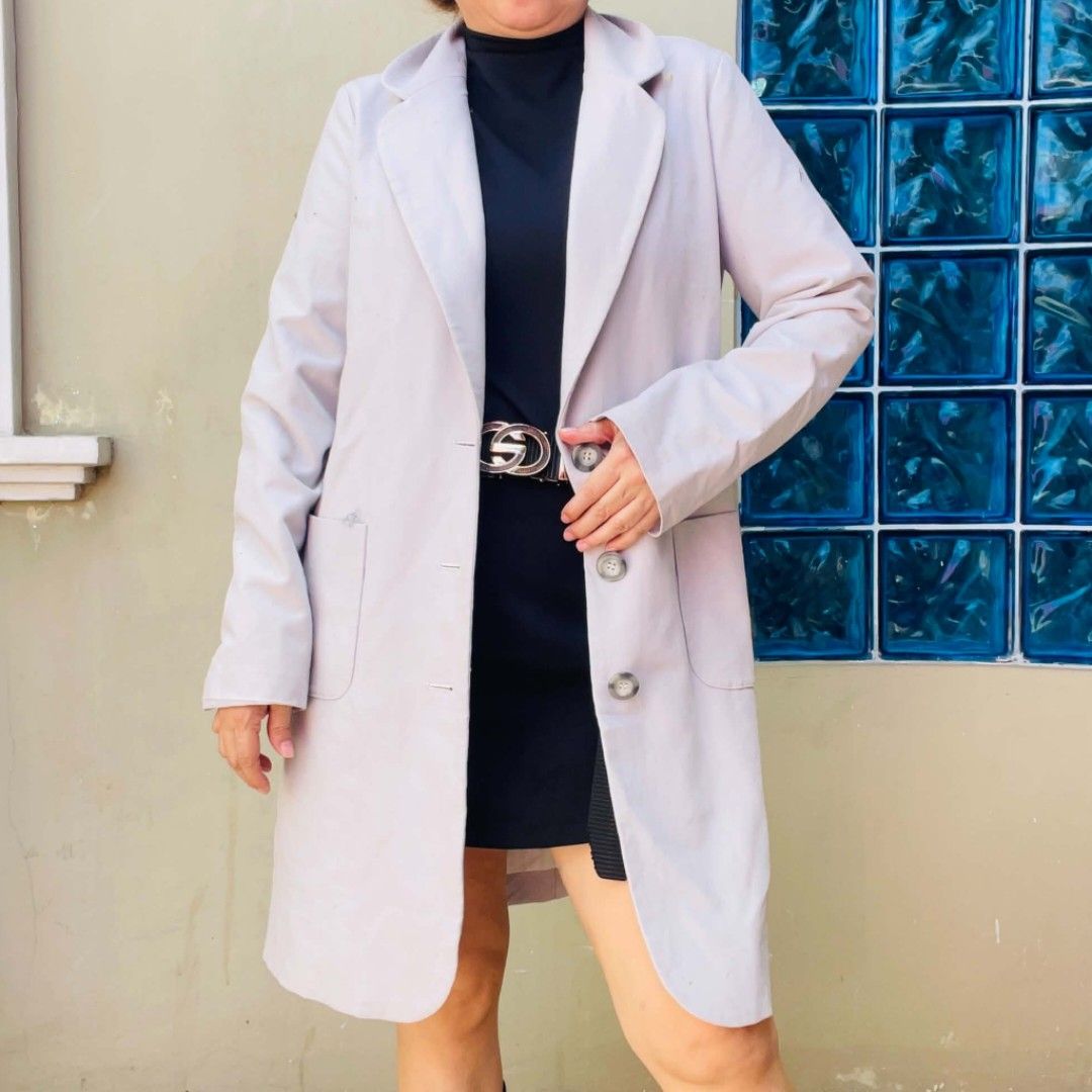 Light purple long trench coat with button closures (Category: Coats, Jackets and Outerwear) located in Bulacan. Submitted by fenph2021 (Listing ID 1468304738, Image 1). Description: - Color: Light purple - Length: Knee length - Closure: Front button with 3 dark buttons - Pockets: Two side pockets - Style: Lapel collar, long sleeves, clean finish - Perfect layering piece for cooler weather.