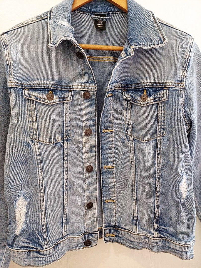 Light wash distressed denim jacket (Category: Coats, Jackets and Outerwear) located in Pasig City. Submitted by eden_online_shop (Listing ID 1468341664, Image 3). Description: - Shoulder: 41cm - Length: 50cm - Width: 40cm - Bust: 36cm - Fits S - Color/Wash: Light wash denim - Design: Stylish distressing details on the front - Closure: Button-up front and fitted button cuffs - Pockets: Two functional chest pockets - Neckline: Classic collar - Fit/