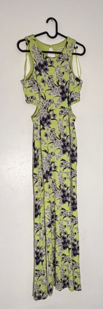 Lime Green Floral Cutout Dress (Category: Dresses) located in Pasig City. Submitted by elegantdress (Listing ID 1468303608, Image 1). Description: - Vibrant lime green sleeveless long dress with a purple and grey floral print - Trendy cutout details at the sides of the waist - Classic round neckline and ankle-length fit - Lightweight, breathable fabric ideal for warm weather and casual days - Clean, well-maintained, and ready to wear.