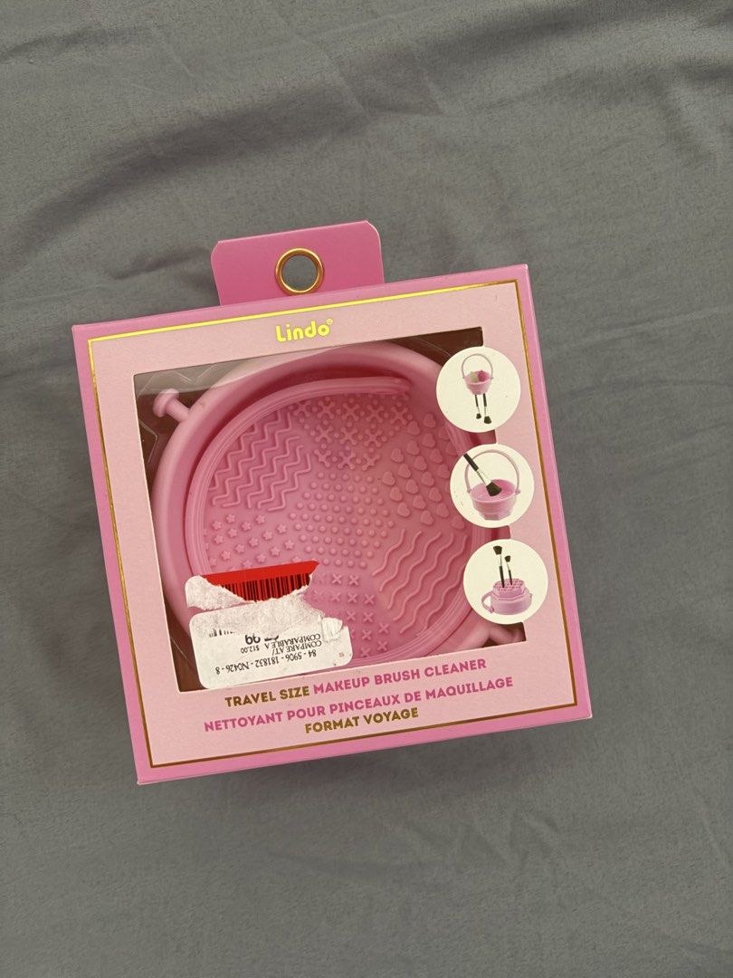 Lindo Makeup Brush Cleaner Pink (Category: Makeup) located in Manila. Submitted by izzmya (Listing ID 1468346326, Image 1). Description: - Brand: Lindo - Color: Pink - Material: High-quality silicone with detachable parts - Function: Cleans, dries, and stores makeup brushes - Extra Feature: Flexible strap for hanging brushes upside down - Condition: Brand new in original box.