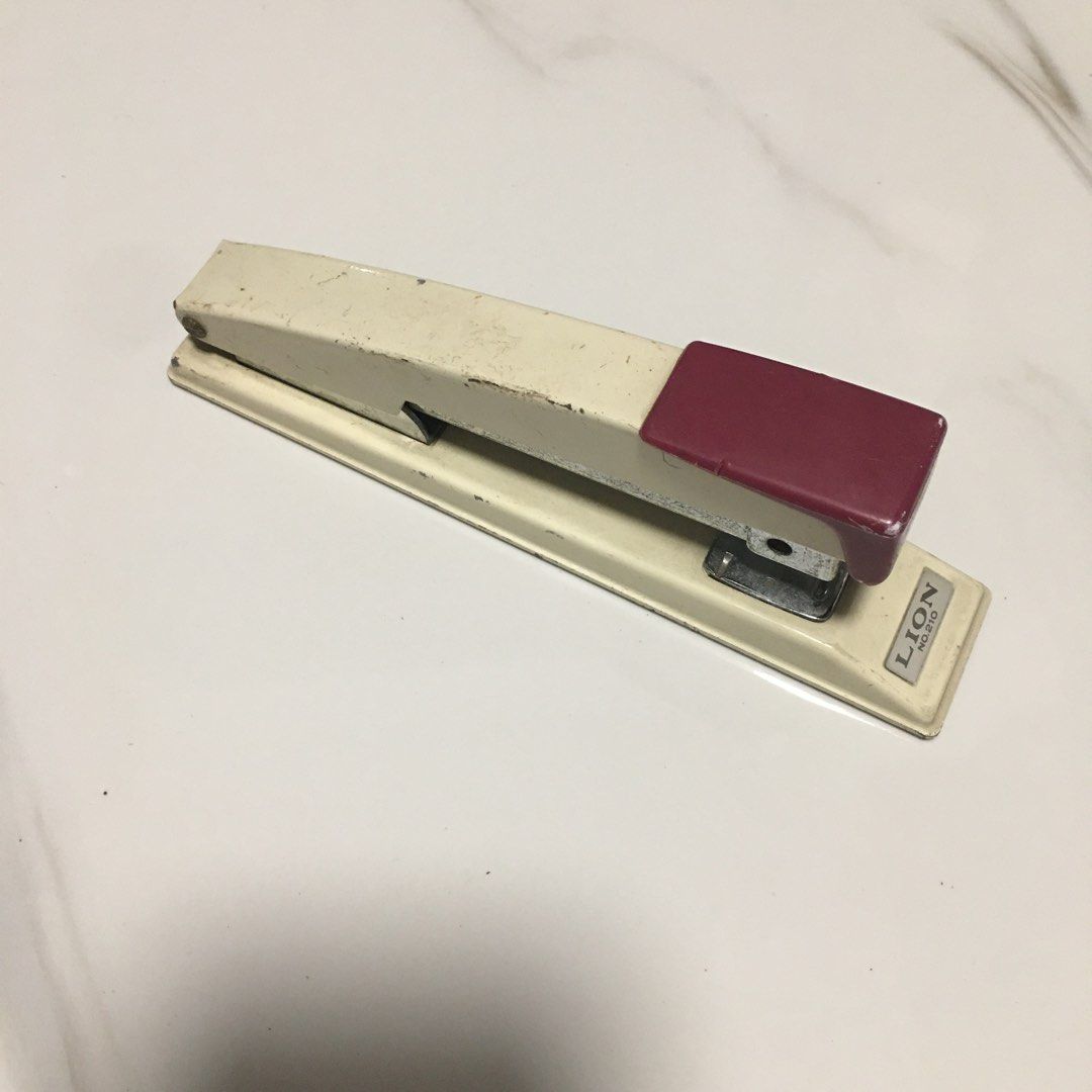 Lion No. 210 Heavy Duty Stapler (Category: Stationery & School Supplies) located in Pasay City. Submitted by gilbertso62551 (Listing ID 1468387416, Image 2). Description: - Brand/Model: Lion No. 210 Heavy-Duty Desktop Stapler - Colorway: Retro cream and maroon - Build: Sturdy metal construction with non-slip rubber grip pads underneath - Features: Long-reach mechanism, perfect for binding thick stacks of paper - Staple Type: Uses No. 210 staples 
