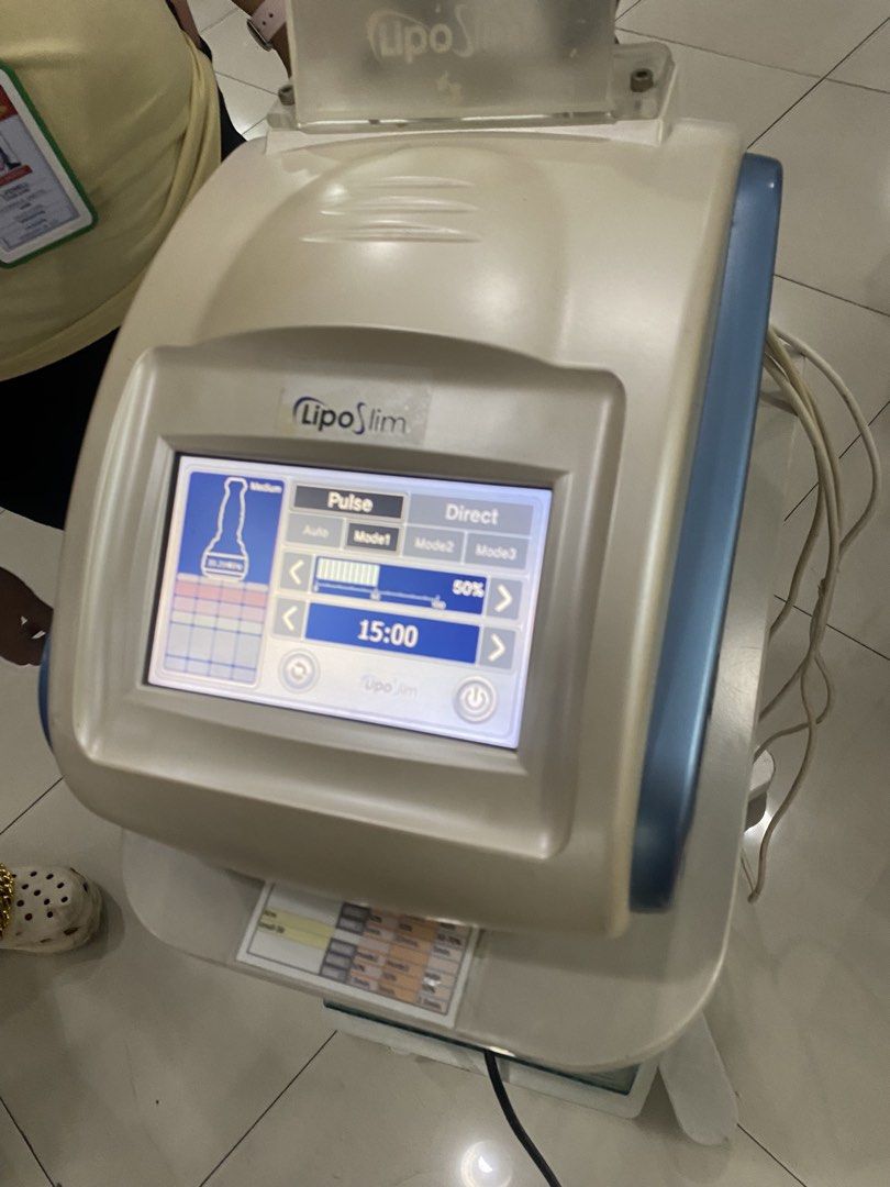 Lipo Slim Body Contouring Machine with Touchscreen (Category: Body Care) located in Marikina City. Submitted by jtv17 (Listing ID 1468309866, Image 1). Description: - Professional Lipo Slim body contouring and fat reduction machine - Touchscreen control panel featuring Pulse and Direct settings with multiple modes - Includes two applicator heads and a convenient rolling stand with storage shelf - Fully functional and power-up tested - Perfect for