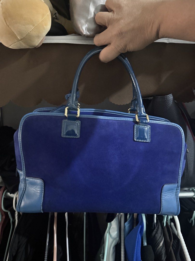 Loewe Madrid 1846 Suede Blue Handbag (Category: Luxury Bags & Wallets) located in Cebu City. Submitted by generationxjoshgo (Listing ID 1468339657, Image 2). Description: - Brand: Loewe Madrid 1846 - Color: Rich blue suede body with smooth blue leather trim and top handles - Details: Embossed Anagram logo on the front and premium gold-tone hardware - Interior: Tan leather lining with a convenient zippered side pocket and blue Loewe brand tag - Co