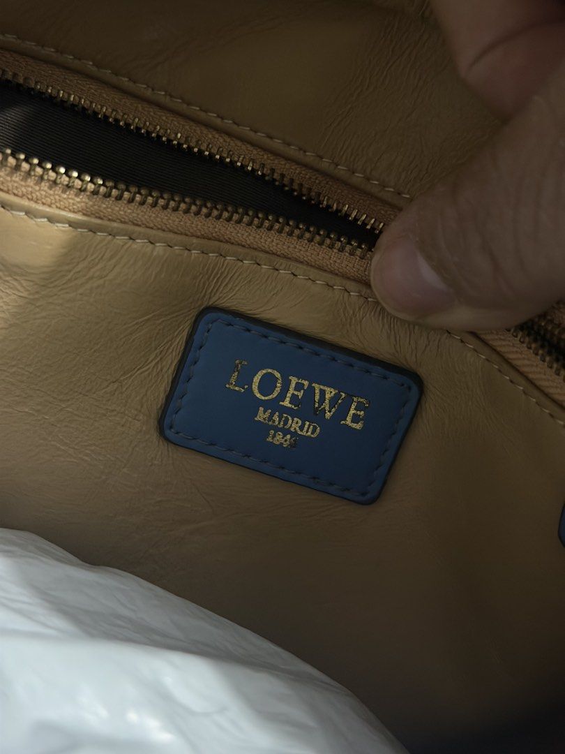 Loewe Madrid 1846 Suede Blue Handbag (Category: Luxury Bags & Wallets) located in Cebu City. Submitted by generationxjoshgo (Listing ID 1468339657, Image 3). Description: - Brand: Loewe Madrid 1846 - Color: Rich blue suede body with smooth blue leather trim and top handles - Details: Embossed Anagram logo on the front and premium gold-tone hardware - Interior: Tan leather lining with a convenient zippered side pocket and blue Loewe brand tag - Co