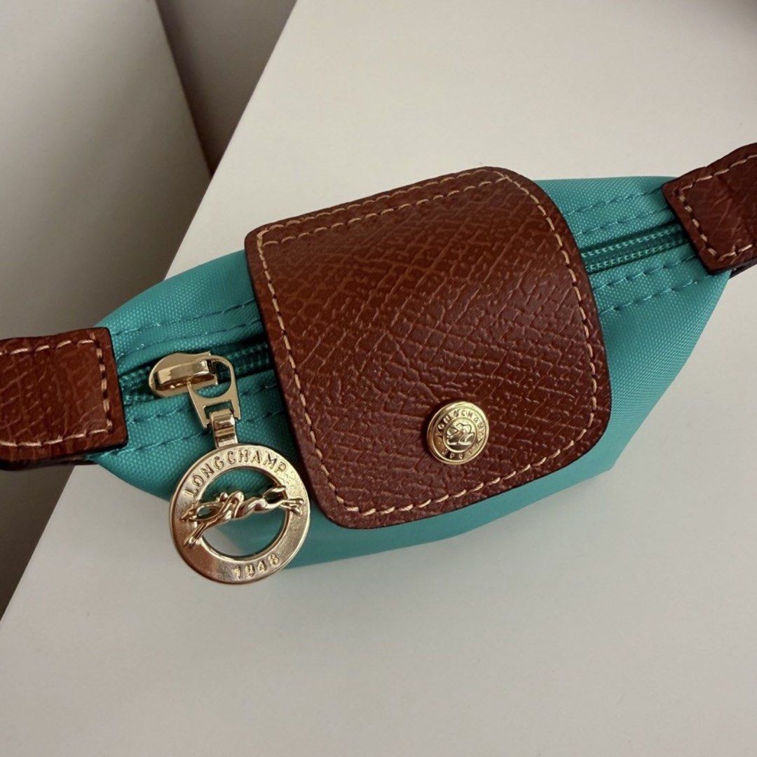 Longchamp Coin Purse (Turquoise) (Category: Luxury Bags & Wallets) located in Caloocan City. Submitted by anne0532 (Listing ID 1468338097, Image 2). Description: freebie: bag organizer.
