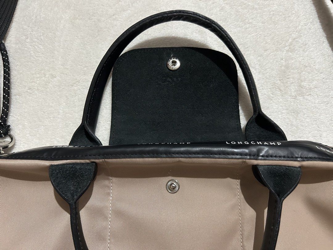 Longchamp Lepliage Energy Bag (Category: Luxury Bags & Wallets) located in Baguio. Submitted by previouslymine.10 (Listing ID 1468394076, Image 3). Description: Small size with top handle and sling Very good condition, no flaws.