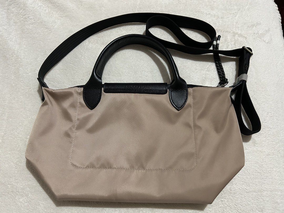 Longchamp Lepliage Energy Bag (Category: Luxury Bags & Wallets) located in Baguio. Submitted by previouslymine.10 (Listing ID 1468394076, Image 2). Description: Small size with top handle and sling Very good condition, no flaws.
