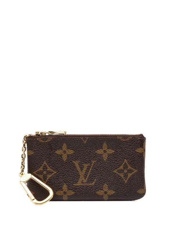 Louis Vuitton Monogram Key Pouch coin pouch (Category: Luxury Bags & Wallets) located in Manila. Submitted by madecuratedwithlove11 (Listing ID 1468460718, Image 1). Description: - Louis Vuitton monogram canvas coin purse and key holder - Classic brown exterior with iconic LV monogram pattern - Gold-tone hardware with attached chain and hook - Secure zip top closure - Interior stamped Louis Vuitton Paris made in France - Compact size fits easily 