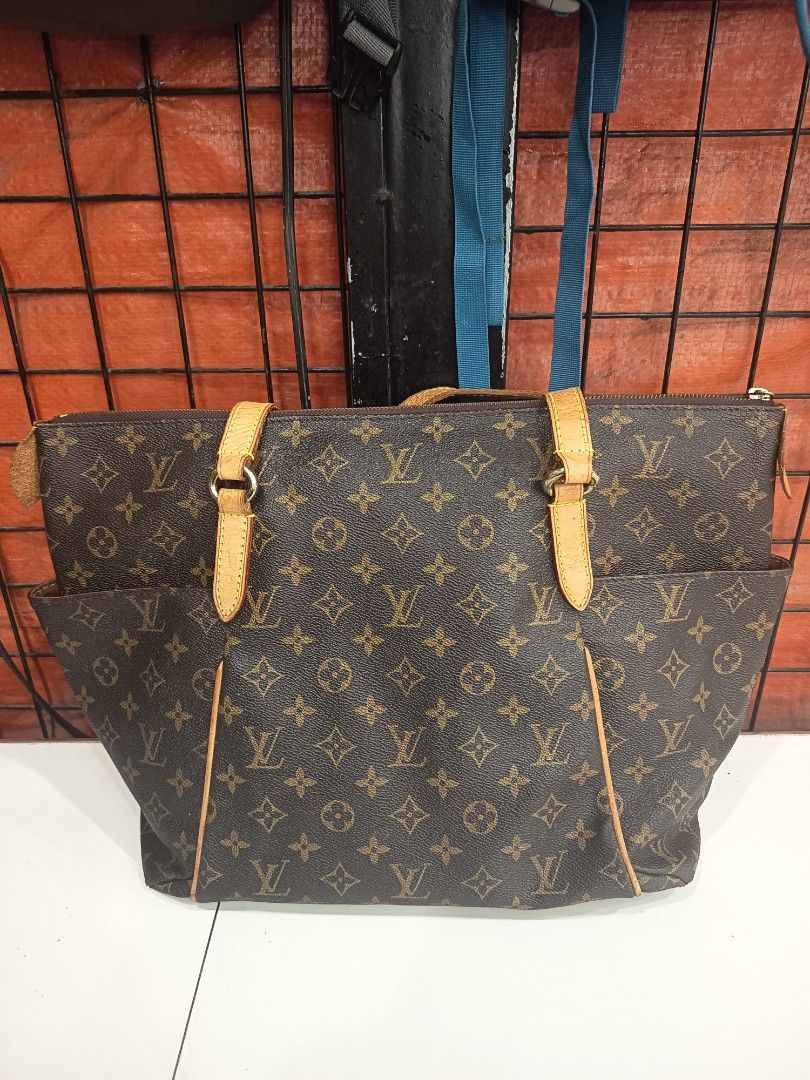 Louis Vuitton Monogram Canvas Tote Bag (Category: Luxury Bags & Wallets) located in Manila. Submitted by youngbear.185ac4 (Listing ID 1468304226, Image 1). Description: - Classic Monogram canvas with brown leather trim - Secure zippered top closure and convenient front slip pockets - Dual top handles and brown fabric interior lining - Made in France - Condition: Shows normal wear on corners and leather straps.