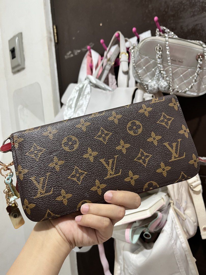 Louis Vuitton Monogram Canvas Long Zip Wallet Red Interior (Category: Luxury Bags & Wallets) located in Manila. Submitted by alygnoida (Listing ID 1468354410, Image 1). Description: - Brand: Louis Vuitton - Material: Monogram canvas with bright red leather lining - Closure: Secure all-around zipper with gold-tone hardware and charm - Interior: Multiple card slots, zipper coin pocket, and spacious main compartments - Condition: Interior shows gent