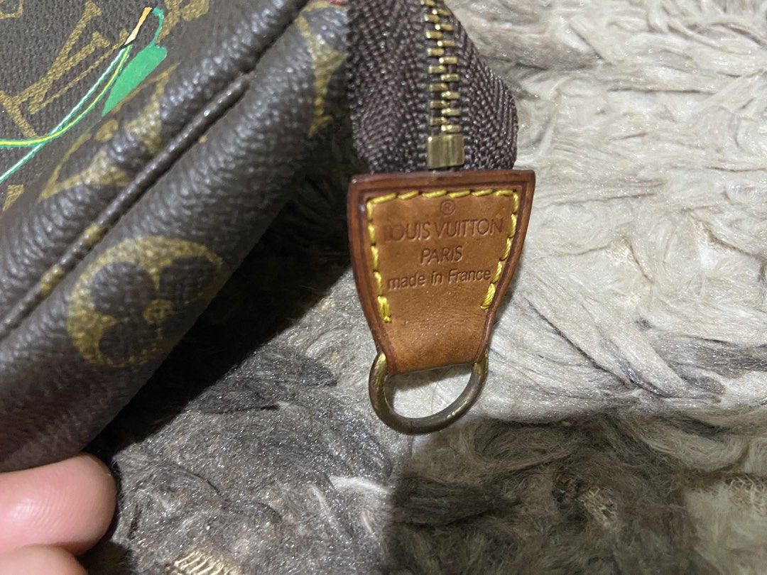 Louis Vuitton Monogram Cherry Pochette Accessoires (Category: Luxury Bags & Wallets) located in Davao. Submitted by mengsmixitems (Listing ID 1468359560, Image 2). Description: - Authentic Louis Vuitton monogram canvas pouch with a limited-edition cherry print - Classic brown and tan colorway with polished gold-tone hardware - Secure zip closure with leather pull tab (stamped Louis Vuitton Paris, Made in France) - Features interior date code FL00