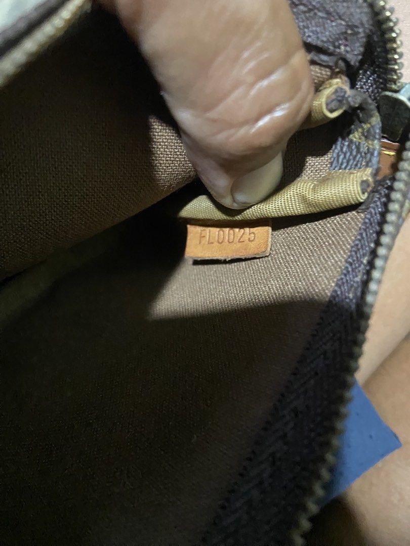 Louis Vuitton Monogram Cherry Pochette Accessoires (Category: Luxury Bags & Wallets) located in Davao. Submitted by mengsmixitems (Listing ID 1468359560, Image 3). Description: - Authentic Louis Vuitton monogram canvas pouch with a limited-edition cherry print - Classic brown and tan colorway with polished gold-tone hardware - Secure zip closure with leather pull tab (stamped Louis Vuitton Paris, Made in France) - Features interior date code FL00