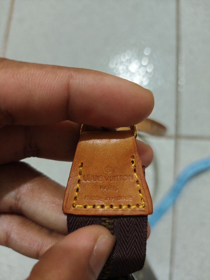 Louis Vuitton Monogram Pochette Accessoires (Category: Luxury Bags & Wallets) located in Isulan. Submitted by jaysthrift (Listing ID 1468296961, Image 3). Description: - Louis Vuitton Monogram Pochette Accessoires - Classic brown monogram canvas with natural leather strap and gold-tone hardware - Dimensions: approx. 8.5 inches across - Secure top zip closure - Fabric-lined interior with Louis Vuitton Paris heat stamp - Stamped leather tab (Louis 