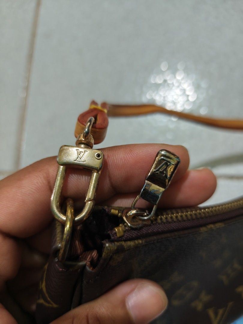 Louis Vuitton Monogram Pochette Accessoires (Category: Luxury Bags & Wallets) located in Isulan. Submitted by jaysthrift (Listing ID 1468296961, Image 2). Description: - Louis Vuitton Monogram Pochette Accessoires - Classic brown monogram canvas with natural leather strap and gold-tone hardware - Dimensions: approx. 8.5 inches across - Secure top zip closure - Fabric-lined interior with Louis Vuitton Paris heat stamp - Stamped leather tab (Louis 