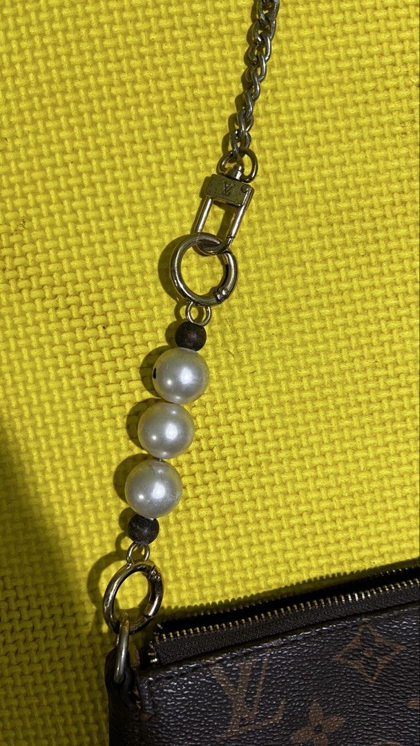 Louis Vuitton Monogram Pochette Accessories with Pearl Chain (Category: Luxury Bags & Wallets) located in Alburquerque. Submitted by ukaydecebuofficial (Listing ID 1468331129, Image 3). Description: - Brand: Louis Vuitton Monogram Canvas Pochette - Hardware: Custom gold-tone chain strap accented with elegant faux pearls - Interior: Clean brown textile lining with a convenient flat pocket - Closure: Secure zip-top closure - Details: Features the i