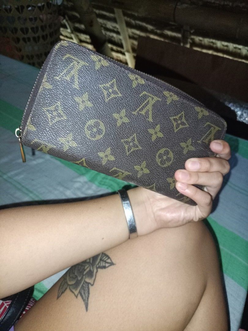 Louis Vuitton Monogram Zip Around Wallet (Category: Luxury Bags & Wallets) located in Naga. Submitted by jowakim19834948 (Listing ID 1468418735, Image 1). Description: - Brand: Louis Vuitton - Material: Monogram canvas with brown leather interior - Style: Zip-around wallet - Features: Multiple card slots, zipped coin compartment, smooth-running zipper - Authenticity: Stamped Louis Vuitton Paris Made in France, includes serial number A60017M - Con