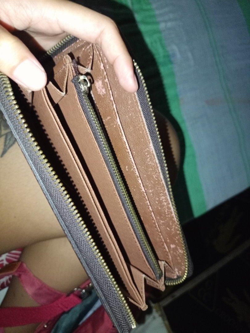 Louis Vuitton Monogram Zip Around Wallet (Category: Luxury Bags & Wallets) located in Naga. Submitted by jowakim19834948 (Listing ID 1468418735, Image 2). Description: - Brand: Louis Vuitton - Material: Monogram canvas with brown leather interior - Style: Zip-around wallet - Features: Multiple card slots, zipped coin compartment, smooth-running zipper - Authenticity: Stamped Louis Vuitton Paris Made in France, includes serial number A60017M - Con