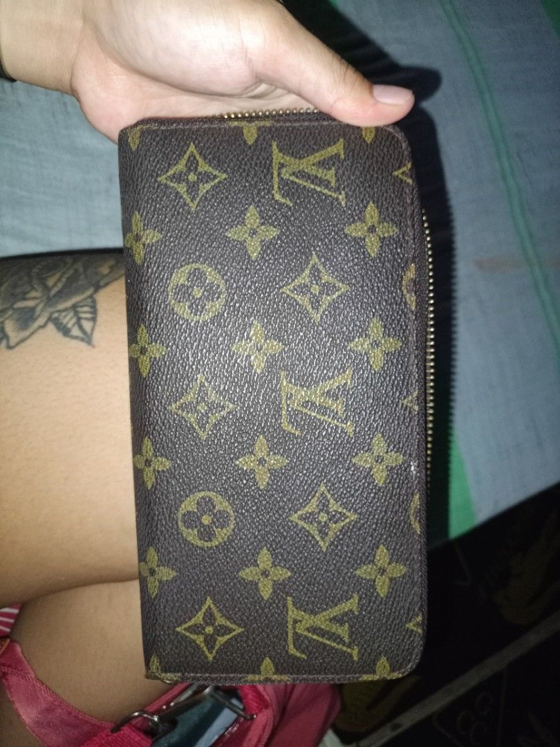 Louis Vuitton Monogram Zip Around Wallet (Category: Luxury Bags & Wallets) located in Naga. Submitted by jowakim19834948 (Listing ID 1468418735, Image 3). Description: - Brand: Louis Vuitton - Material: Monogram canvas with brown leather interior - Style: Zip-around wallet - Features: Multiple card slots, zipped coin compartment, smooth-running zipper - Authenticity: Stamped Louis Vuitton Paris Made in France, includes serial number A60017M - Con