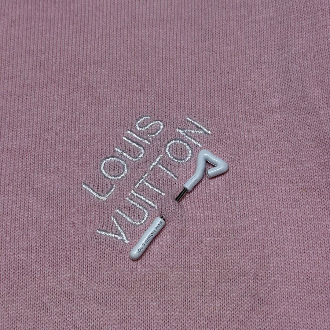 Louis Vuitton Pink Embroidered Tee (Category: Luxury Apparel) located in Kabacan. Submitted by rags2penny.phl (Listing ID 1468334832, Image 3). Description: - Brand: Louis Vuitton - Item: Pink knit t-shirt with embroidered lettering and golf tee chest detail - Details: Ribbed crew neckline, short sleeves, black inner brand tag - Model / Care: RM182M EMB HFY07W, gentle machine wash inside out - Condition: Excellent, clean fabric with no noticeable
