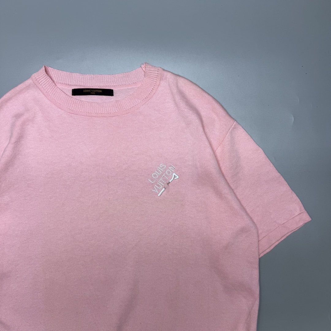 Louis Vuitton Pink Embroidered Tee (Category: Luxury Apparel) located in Kabacan. Submitted by rags2penny.phl (Listing ID 1468334832, Image 2). Description: - Brand: Louis Vuitton - Item: Pink knit t-shirt with embroidered lettering and golf tee chest detail - Details: Ribbed crew neckline, short sleeves, black inner brand tag - Model / Care: RM182M EMB HFY07W, gentle machine wash inside out - Condition: Excellent, clean fabric with no noticeable