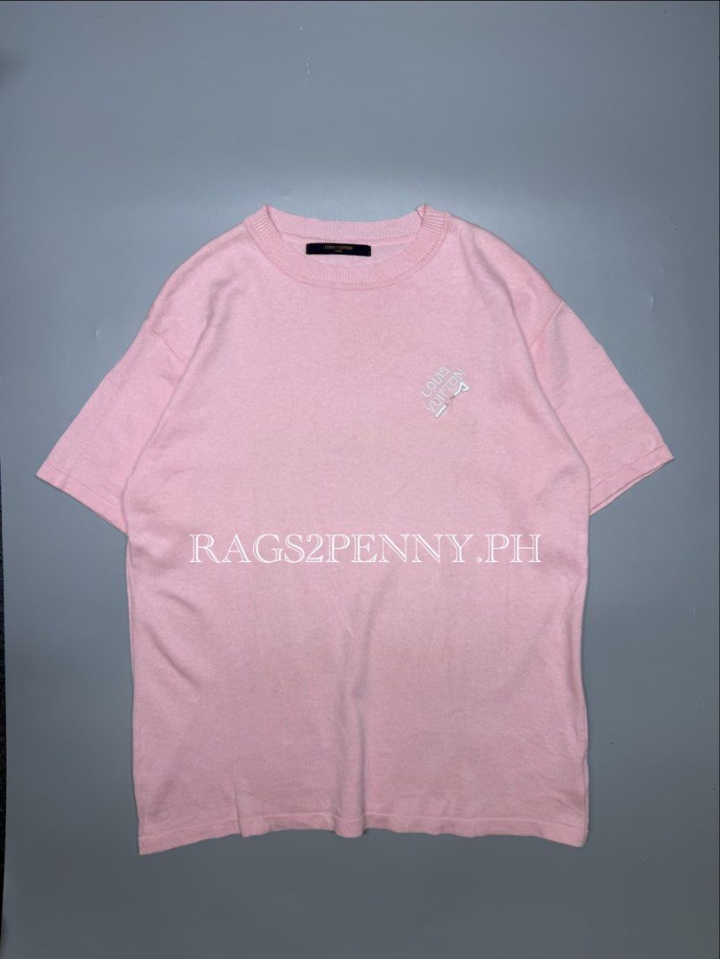 Louis Vuitton Pink Embroidered Tee (Category: Luxury Apparel) located in Kabacan. Submitted by rags2penny.phl (Listing ID 1468334832, Image 1). Description: - Brand: Louis Vuitton - Item: Pink knit t-shirt with embroidered lettering and golf tee chest detail - Details: Ribbed crew neckline, short sleeves, black inner brand tag - Model / Care: RM182M EMB HFY07W, gentle machine wash inside out - Condition: Excellent, clean fabric with no noticeable