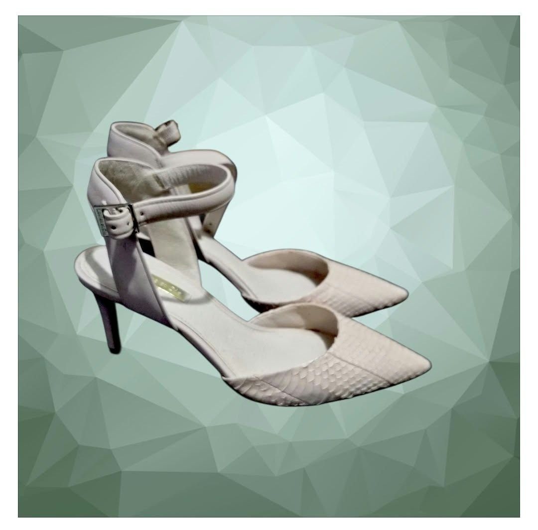 Louise et Cie snake print heels with ankle strap (Category: Heels) located in Paranaque City. Submitted by calm_youngstore7 (Listing ID 1468307940, Image 1). Description: Louise et Cie Kota Ankle Strap Pumps in a cream/white snakeskin textured finish. Key Features • Silhouette: Pointed toe d'Orsay pump with a cut-out side profile. • Straps: Adjustable, slim ankle strap featuring a metallic buckle closure. • Heel Type: Slender stiletto heel measur