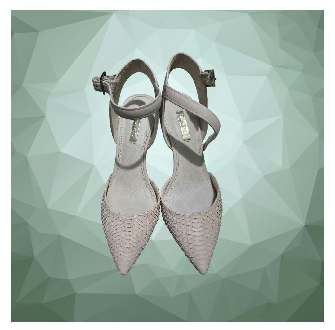 Louise et Cie snake print heels with ankle strap (Category: Heels) located in Paranaque City. Submitted by calm_youngstore7 (Listing ID 1468307940, Image 3). Description: Louise et Cie Kota Ankle Strap Pumps in a cream/white snakeskin textured finish. Key Features • Silhouette: Pointed toe d'Orsay pump with a cut-out side profile. • Straps: Adjustable, slim ankle strap featuring a metallic buckle closure. • Heel Type: Slender stiletto heel measur
