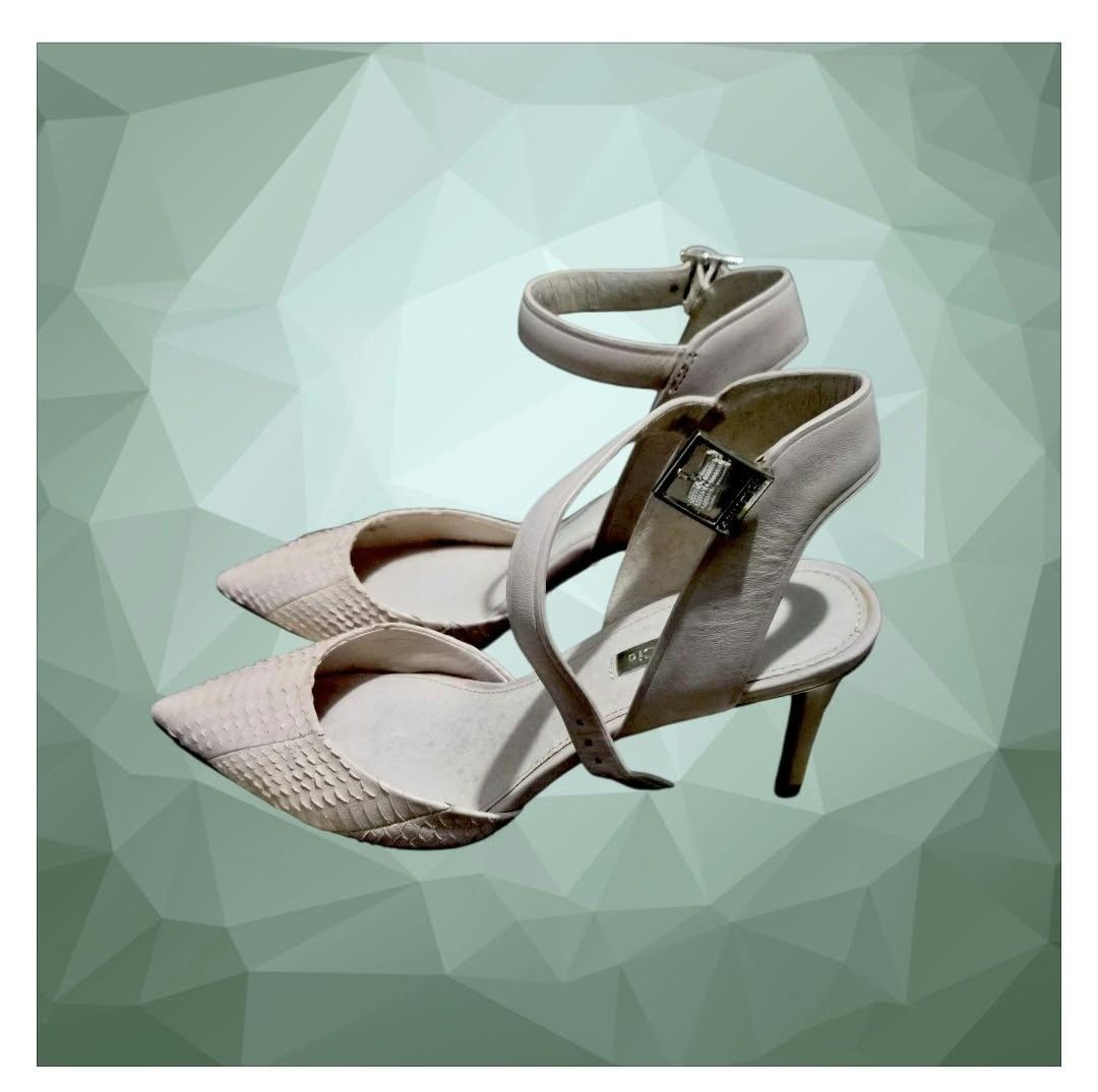Louise et Cie snake print heels with ankle strap (Category: Heels) located in Paranaque City. Submitted by calm_youngstore7 (Listing ID 1468307940, Image 2). Description: Louise et Cie Kota Ankle Strap Pumps in a cream/white snakeskin textured finish. Key Features • Silhouette: Pointed toe d'Orsay pump with a cut-out side profile. • Straps: Adjustable, slim ankle strap featuring a metallic buckle closure. • Heel Type: Slender stiletto heel measur