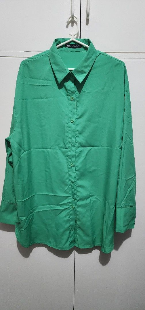 Lovito Green Long Sleeve Button Down Blouse Shirt (Category: Longsleeves) located in Mandaluyong City. Submitted by ghostrider114 (Listing ID 1468325159, Image 1). Description: - Brand: Lovito - Color: Vibrant bright green - Style: Classic collar, long sleeves with cuffs, front button closure - Fit: Relaxed and comfortable - Material: Lightweight fabric - Versatility: Easy to style for both casual days and office wear -Item Location: Makati -Only