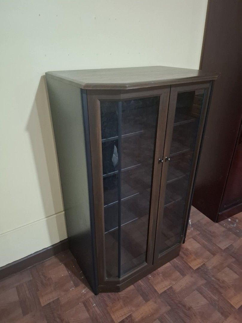 Low Type Display Side Cabinet (Category: Shelves, Cabinets & Racks) located in Quezon City. Submitted by dannikkishoppe2 (Listing ID 1468491580, Image 3). Description: Low Type Display Side Cabinet ‼️₱5800‼️ L 30 x W20.5 x H47 inches compressed wood, plyboard, glass doors Please manage your expectations as there might be minimal flaws. Color may vary due to lighting, it may appear darker or lighter in person. Check photos first before buying. Ple