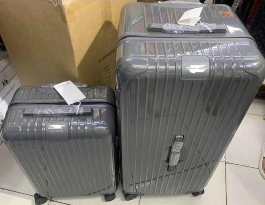 Luggage Set 2-Piece Suitcase cabin 22 & trunk plus 33 (Category: Luggage) located in Manila. Submitted by dh3nz1 (Listing ID 1468368859, Image 3). Description: - Brand new with tags attached - Matching 2-piece set: 1 large check-in suitcase and 1 cabin-size luggage - Stylish and durable vertical ribbed hardshell design - Sleek neutral grey colorway - Smooth-rolling wheels and telescopic handles for easy travel - Heavy-duty zippers and convenient 