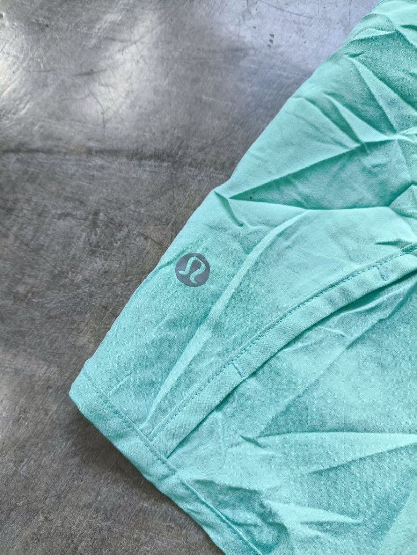 Lululemon Athletic Shorts Size 4 Aqua Blue (Category: Shorts) located in Manila. Submitted by maryaganda (Listing ID 1468354547, Image 3). Description: - Brand: Lululemon - Color: Bright aqua blue - Size: 4 - Features: Secure back waistband zipper pocket for keys/cards, built-in liner, lightweight fabric - Detail: Signature silver reflective logo on the leg - Condition: Brand new with fabric care and size tags attached.
