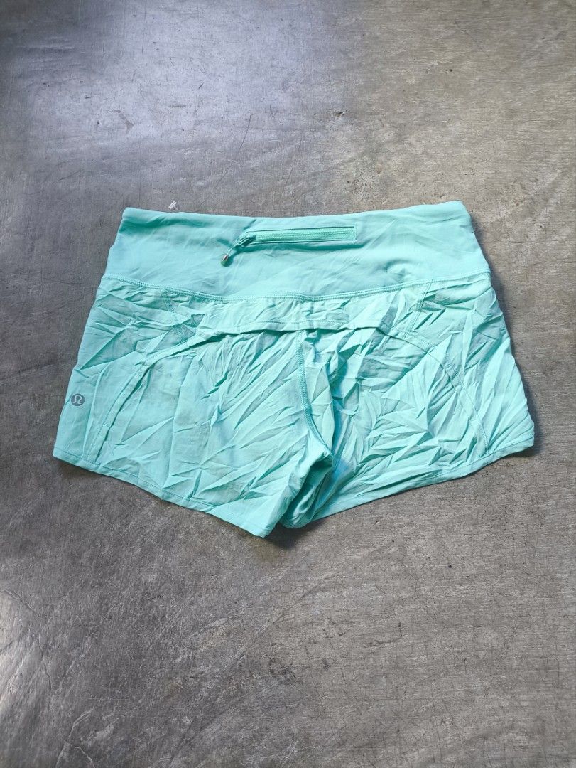 Lululemon Athletic Shorts Size 4 Aqua Blue (Category: Shorts) located in Manila. Submitted by maryaganda (Listing ID 1468354547, Image 1). Description: - Brand: Lululemon - Color: Bright aqua blue - Size: 4 - Features: Secure back waistband zipper pocket for keys/cards, built-in liner, lightweight fabric - Detail: Signature silver reflective logo on the leg - Condition: Brand new with fabric care and size tags attached.