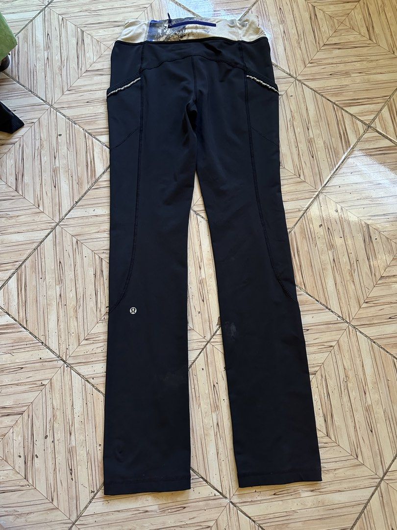 Lululemon Black Athletic Pants Leggings Size 6 (Category: Activewear) located in Angeles City. Submitted by alejeong27 (Listing ID 1468336213, Image 2). Description: - Brand: Lululemon - Size: 6 - Color: Black with blue and white patterned waistband - Pockets: Convenient side pockets and a secure zippered back pocket - Safety: Reflective details on the side seams for low-light visibility - Details: Signature silver Lululemon logo stamped on the l